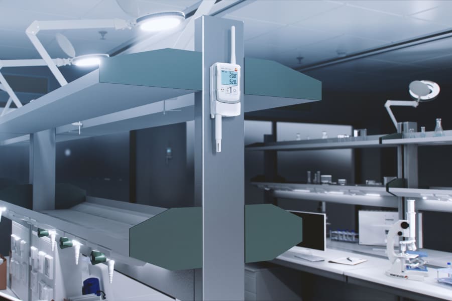 testo 150 logger with testo Ultra Range communication module measuring temperature and humidity in a laboratory.